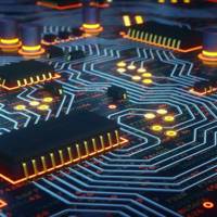 Yellow Glowing Circuit Board Close-Up