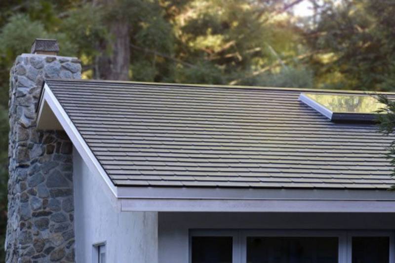 The first houses have been fitted with Tesla's solar roof panels