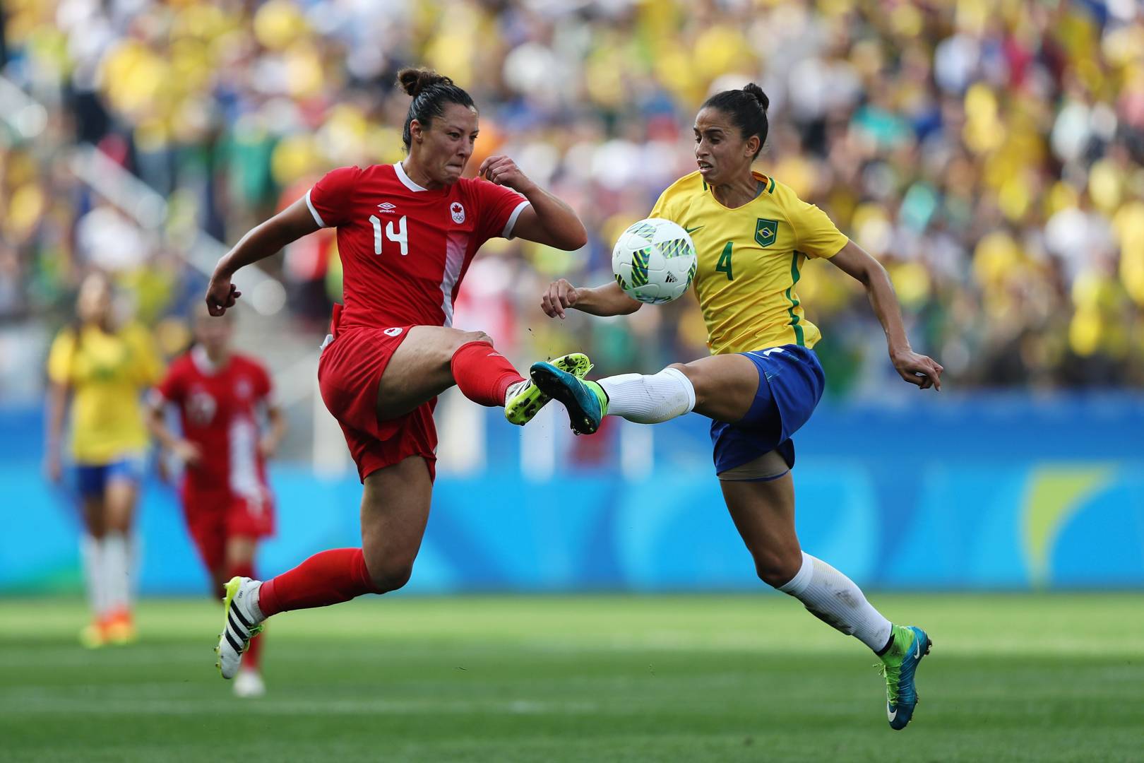 Why are elite female footballers barred from playing with men?